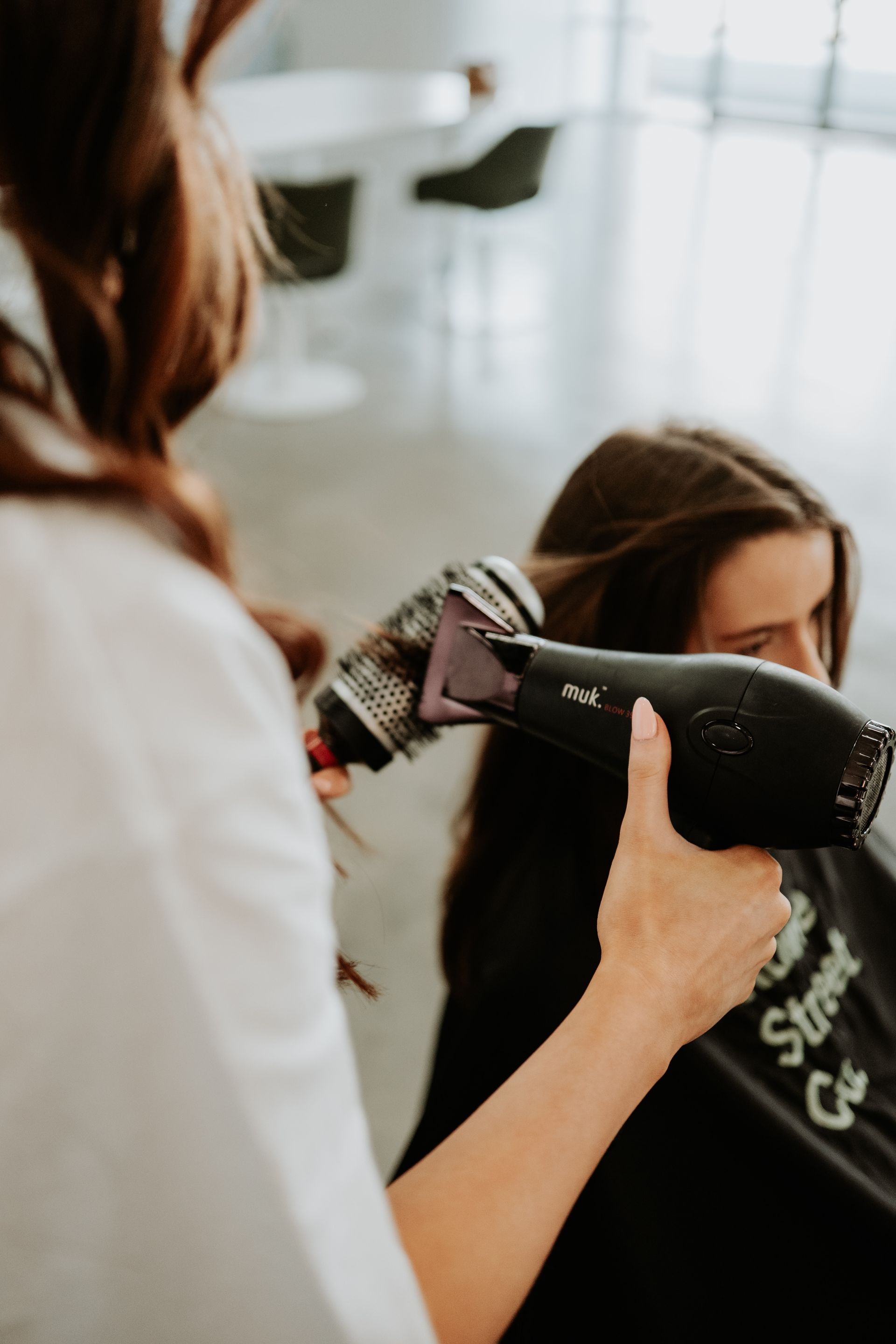 A Woman Is Getting Her Hair Dyed In A Salon — Rowe Street Collective In Shepparton, VIC