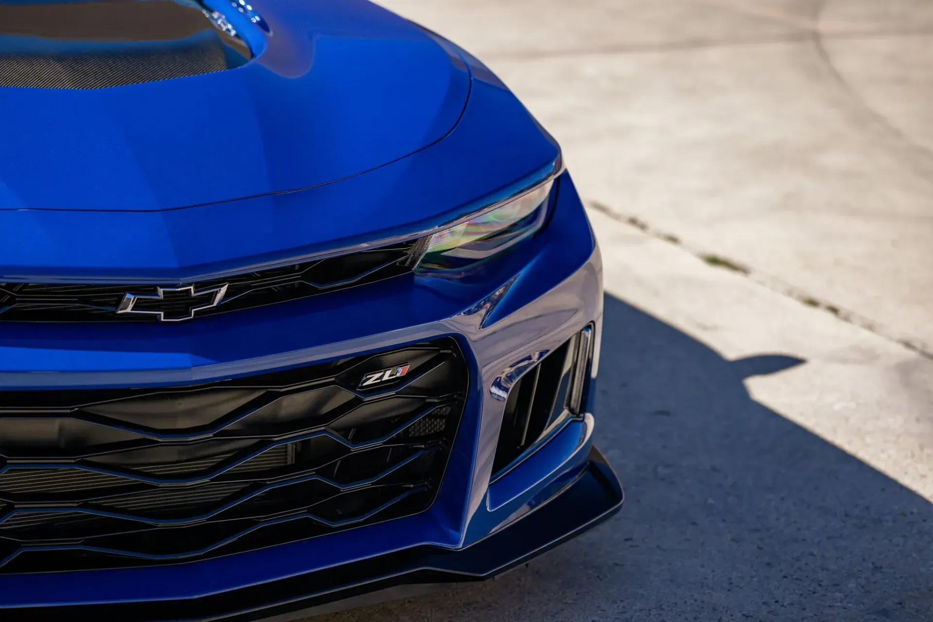 Blue Chevrolet Camaro ZL1 front end.
