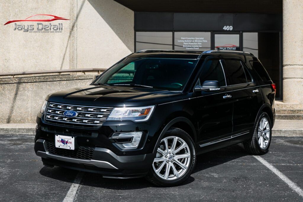 Black Ford Explorer SUV parked in front of a building with a Jays Detail logo and the number 408 on the door.