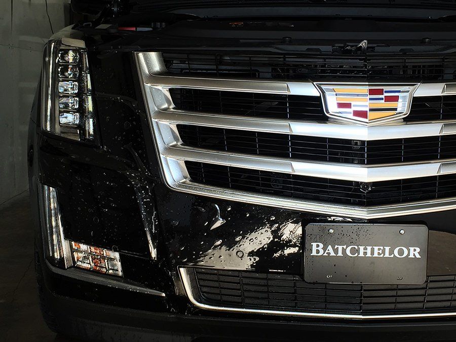 Black Cadillac Escalade front view, chrome grill