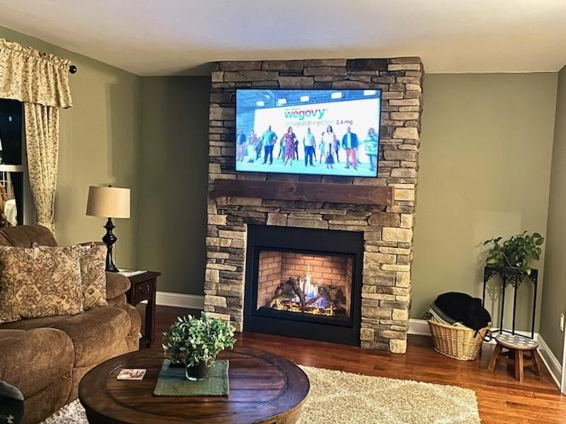 Living Room with TV — Modern Fireplace With Brick Wall in Lan ghorne, PA