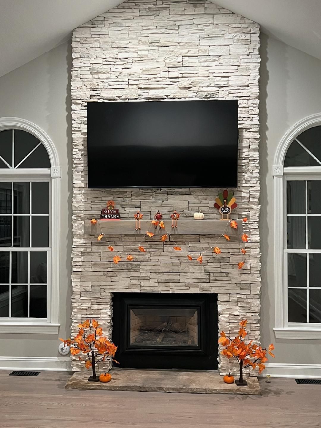 Stone Work — Modern Fireplace With Brick Wall in Lan ghorne, PA