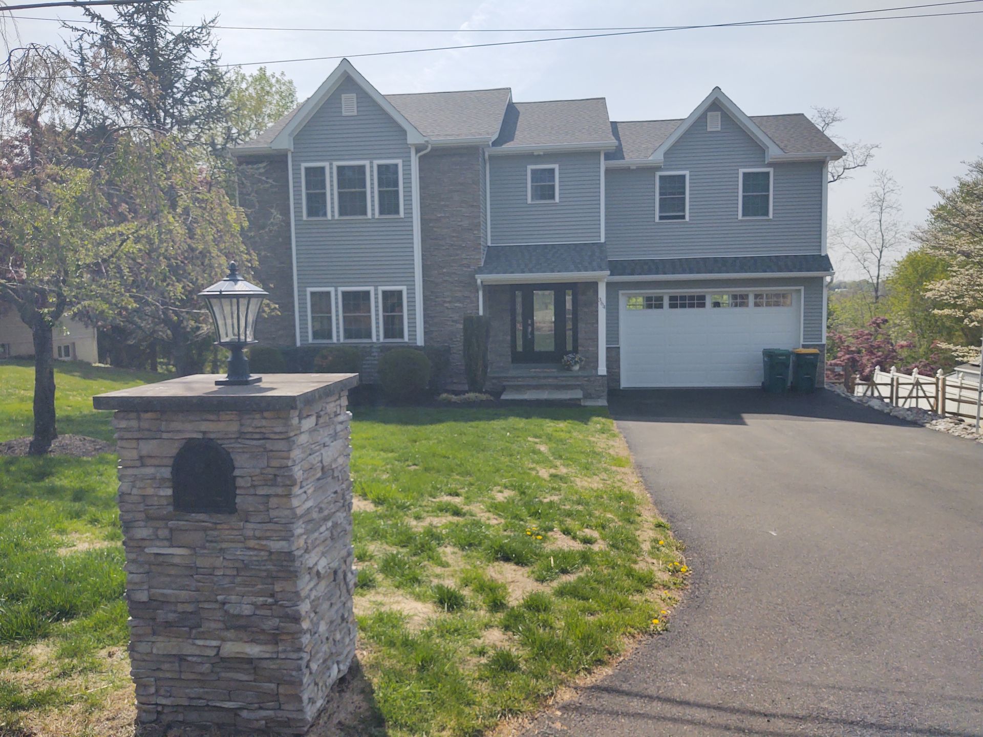 A large house with a mailbox in front of it