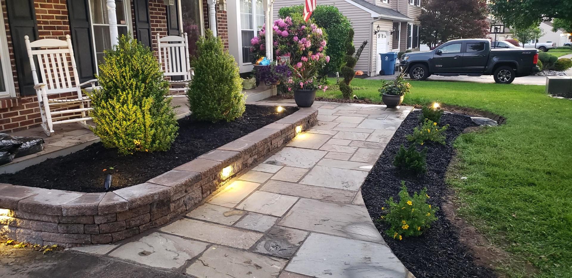 Natural bluestone walkway with chestnut  wall
