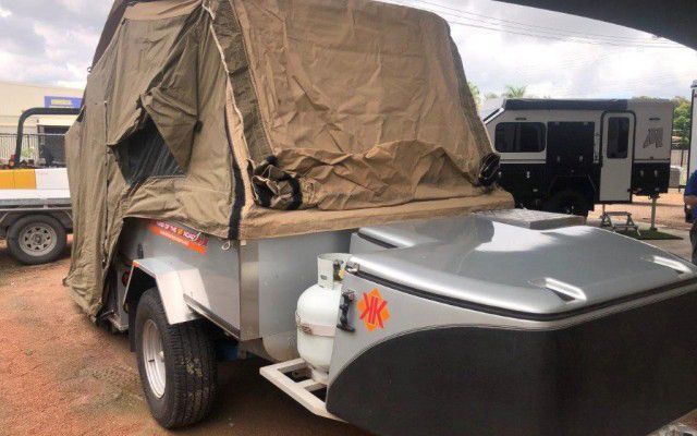 A Trailer With A Tent On Top Of It Is Parked In A Parking Lot - Quality Camper Trailers For Sale In Townsville
