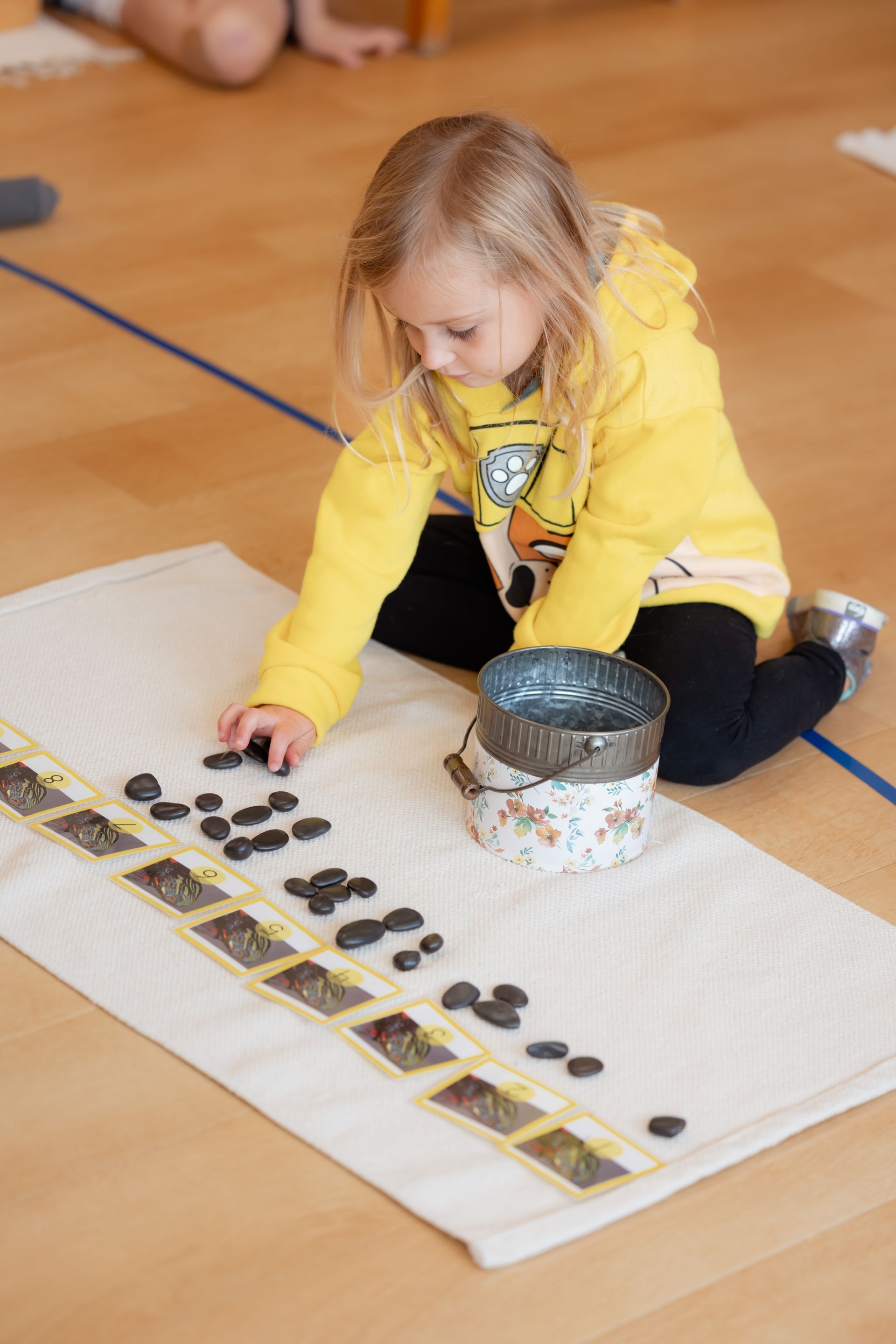 Montessori child working with math materials
