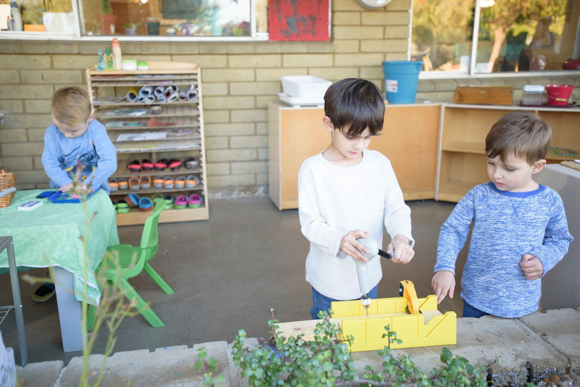 Montessori children working on practical life skills