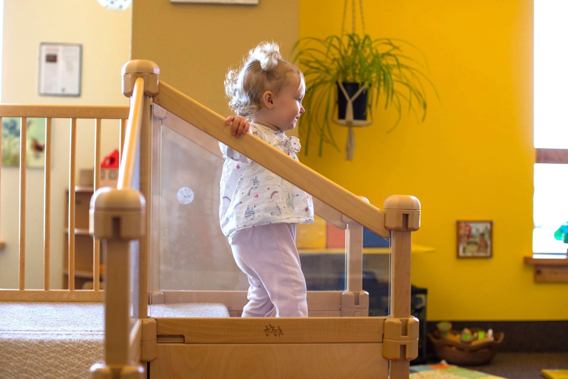 Montessori toddler going down a set of stairs