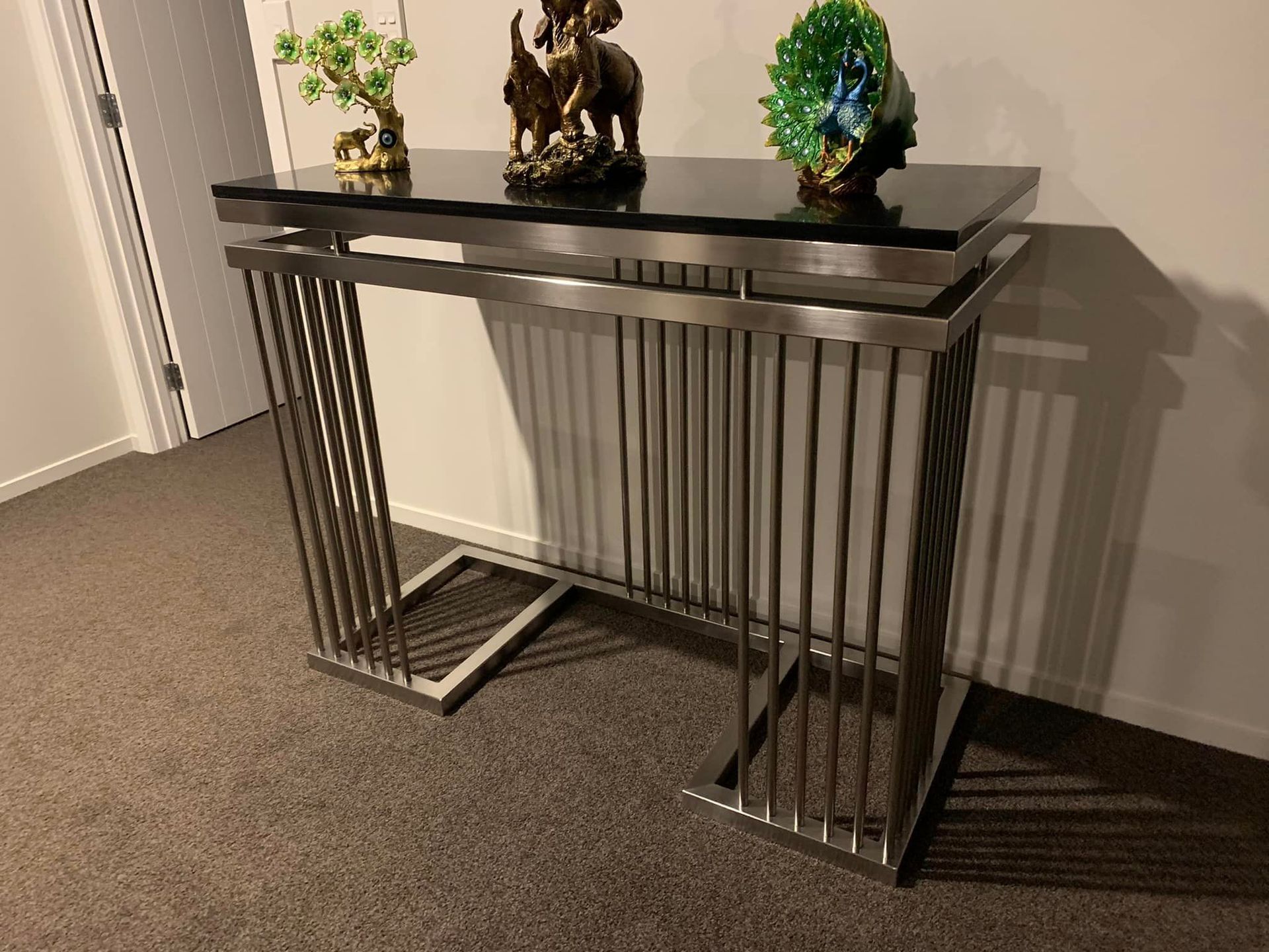 Stainless Steel Console Table with Two Statues on Top of it — Frankton, NZ — Affordable Welding Services Ltd