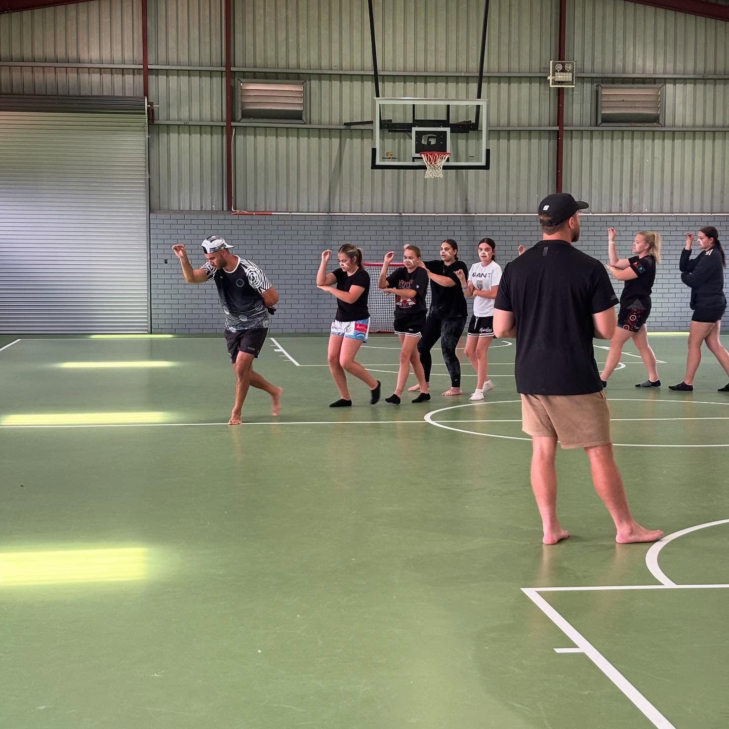 Group of People, Mostly Teenagers, Learning a Dance in a Gymnasium — Dinawans Connection in Forbes, NSW