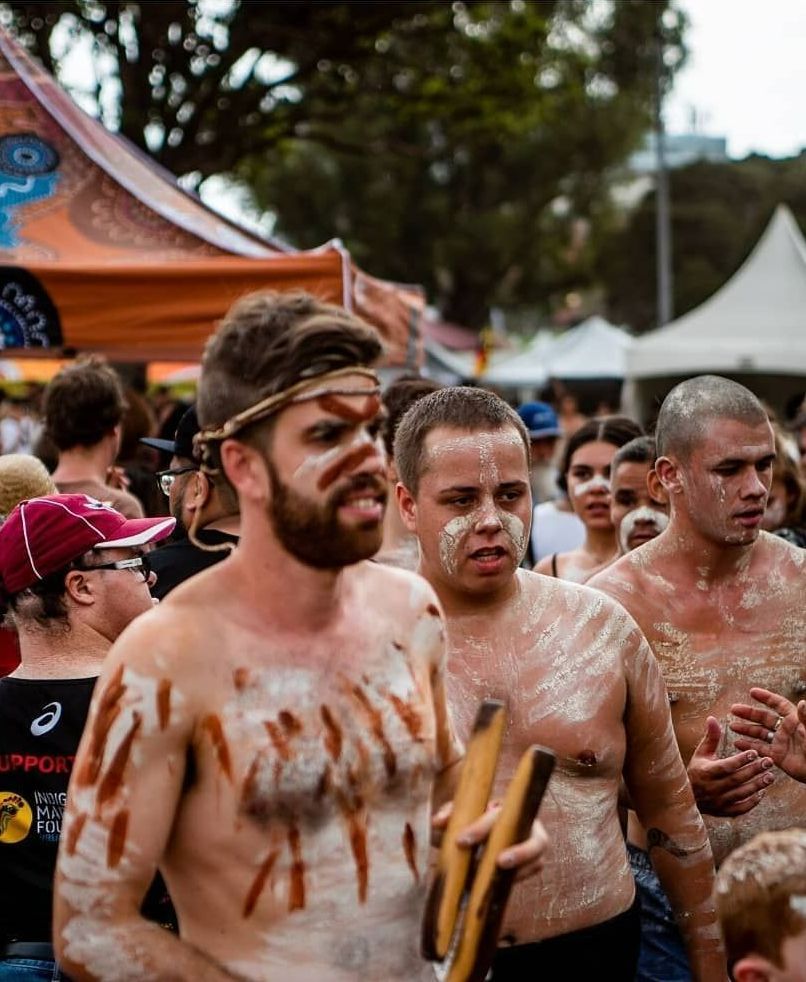 Man Holding Clapsticks — Dinawan's Connection in Dubbo, NSW