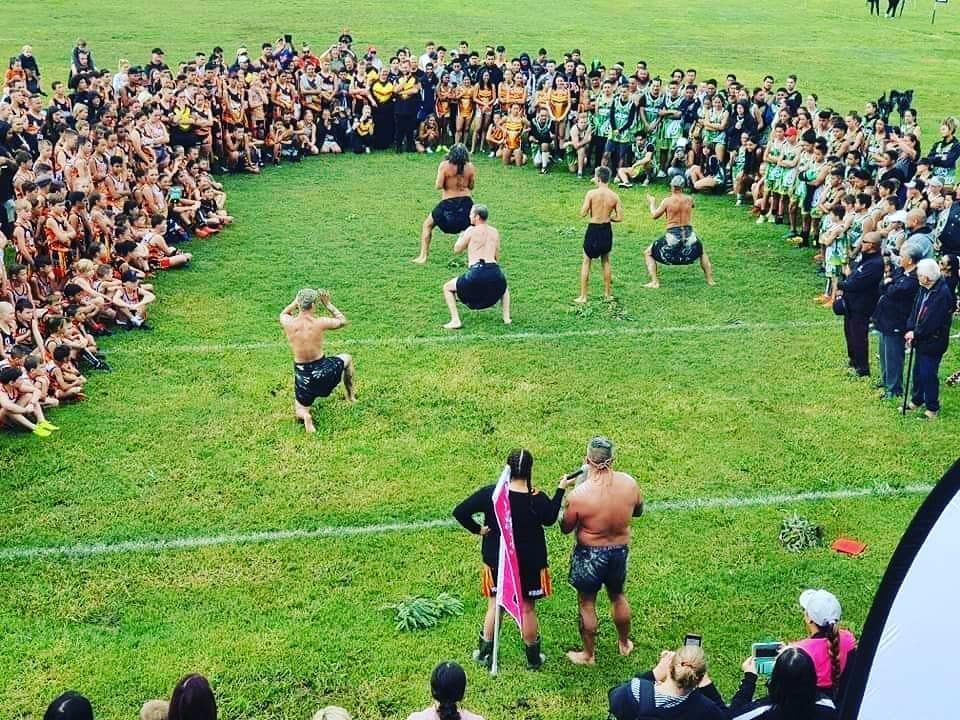 Men Performing a Traditional Dance on Green Grass, Surrounded by People — Dinawans Connection in Wagga, NSW