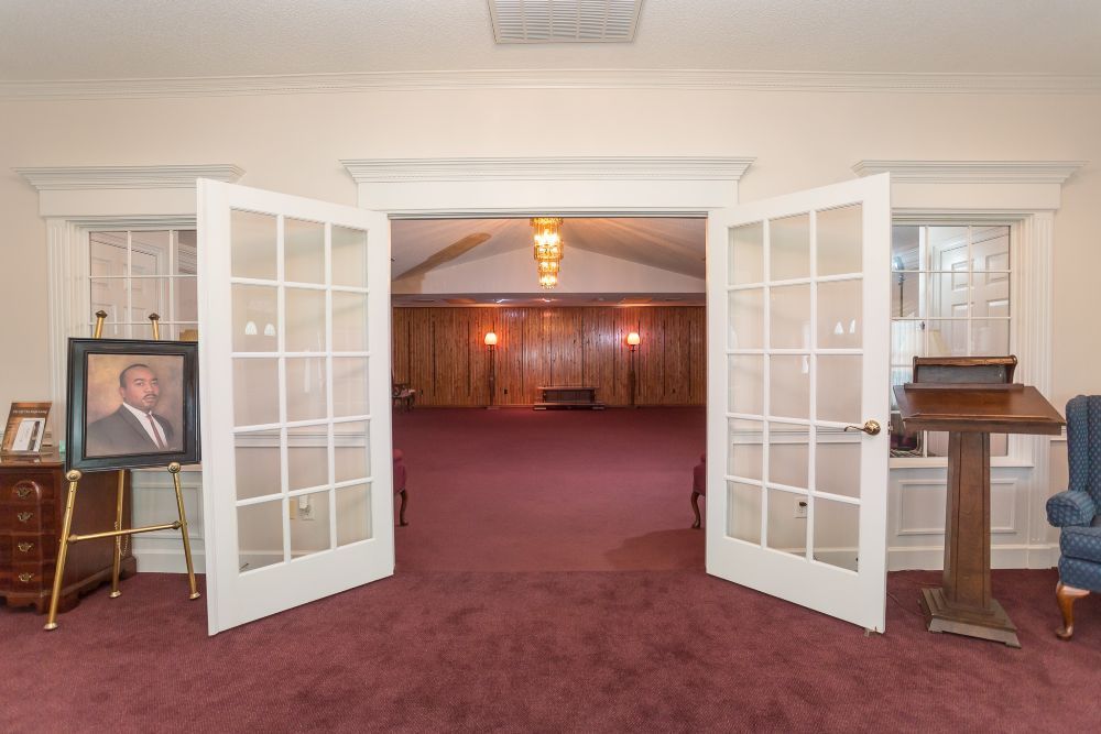 There is a picture of martin luther king jr. on the easel in the room.