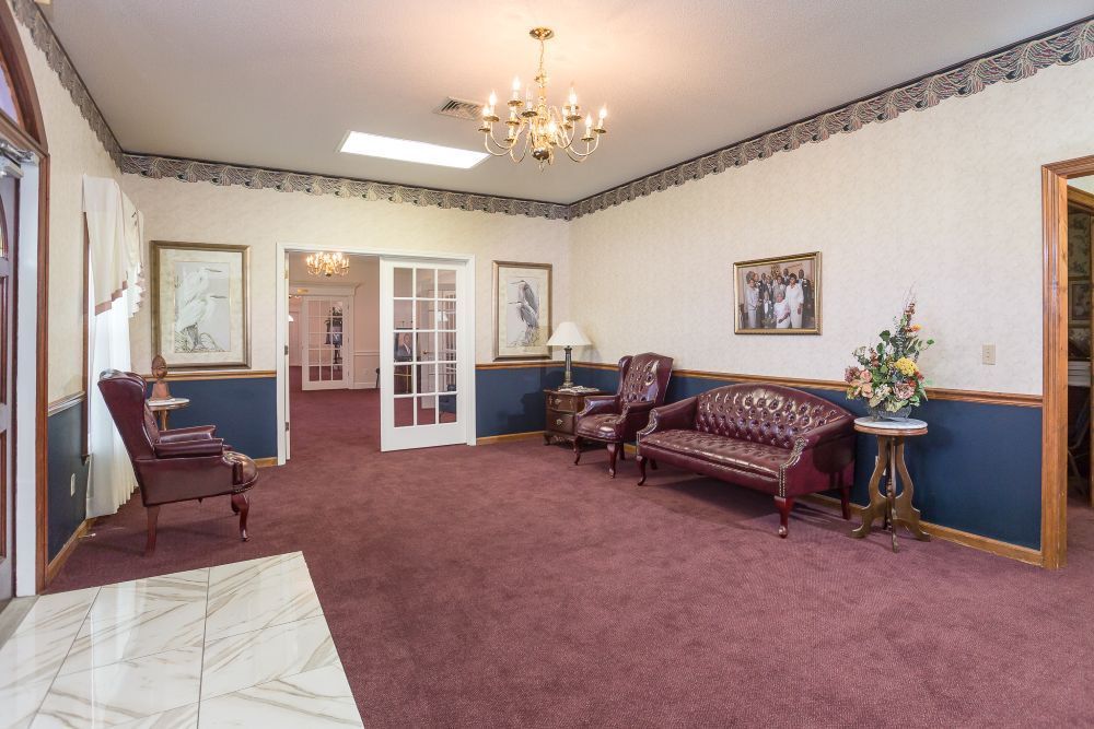 There is a picture of a man on a stand in the middle of the church.