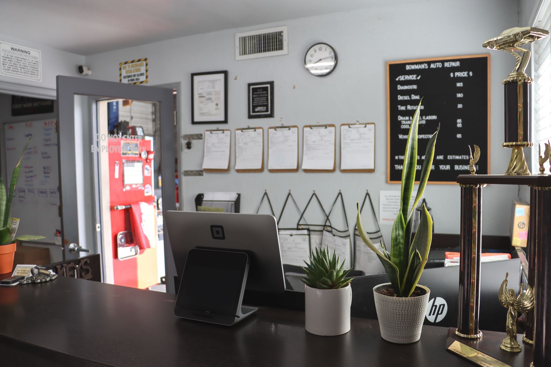 A hp computer is sitting on a desk in a room
