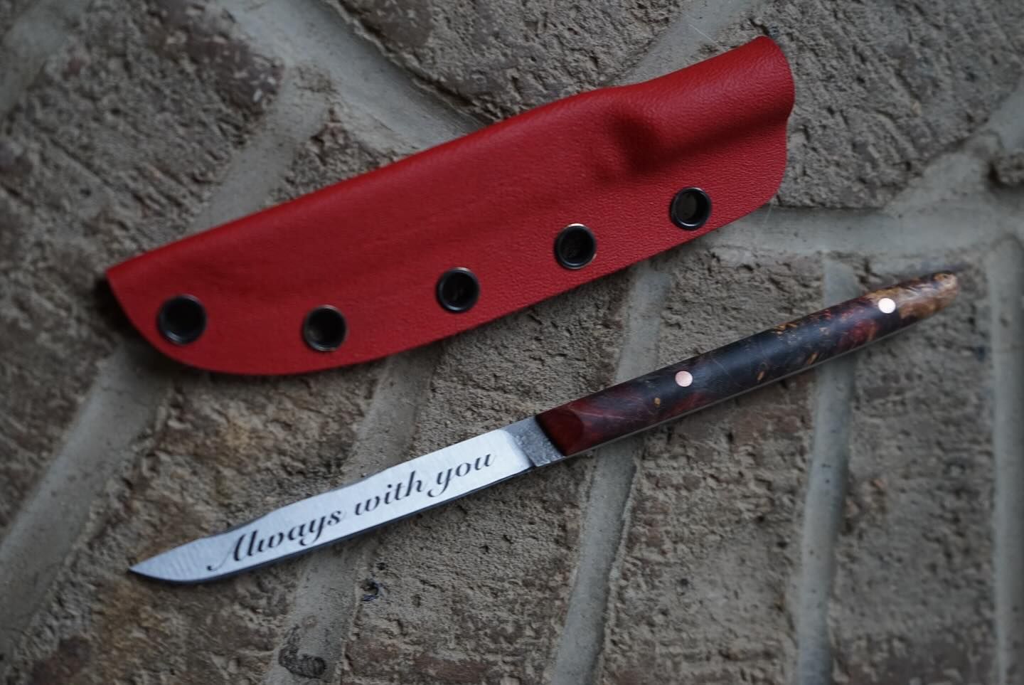 Red leather sheath and engraved knife; 