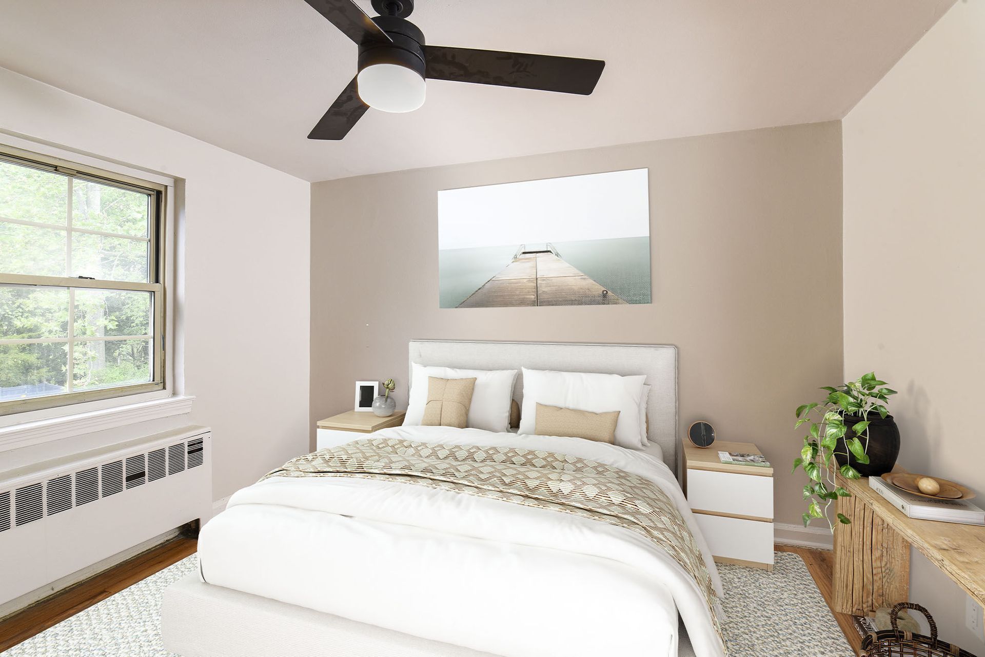 Bright bedroom with a queen bed, two nightstands, a ceiling fan, and a large window.