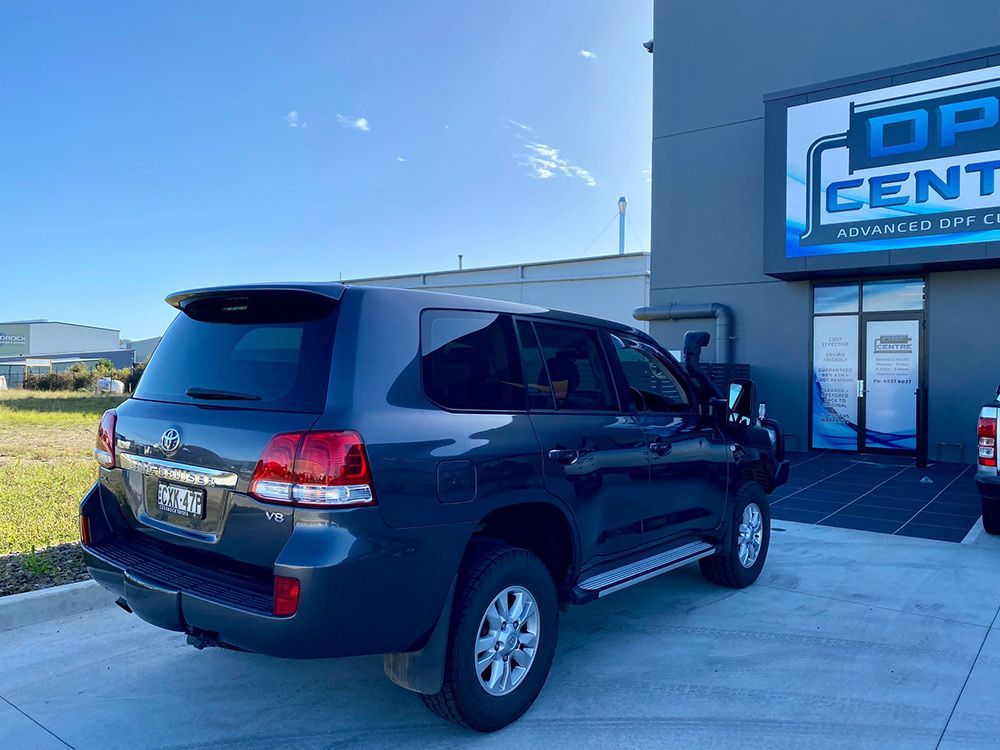 A Black SUV is Parked In Front Of A DPF Centre — DPF Centre In Maitland, NSW