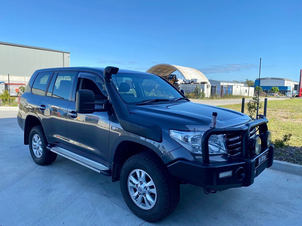 A Black Suv Is Parked On The Side Of The Road — DPF Centre In Cessnock, NSW