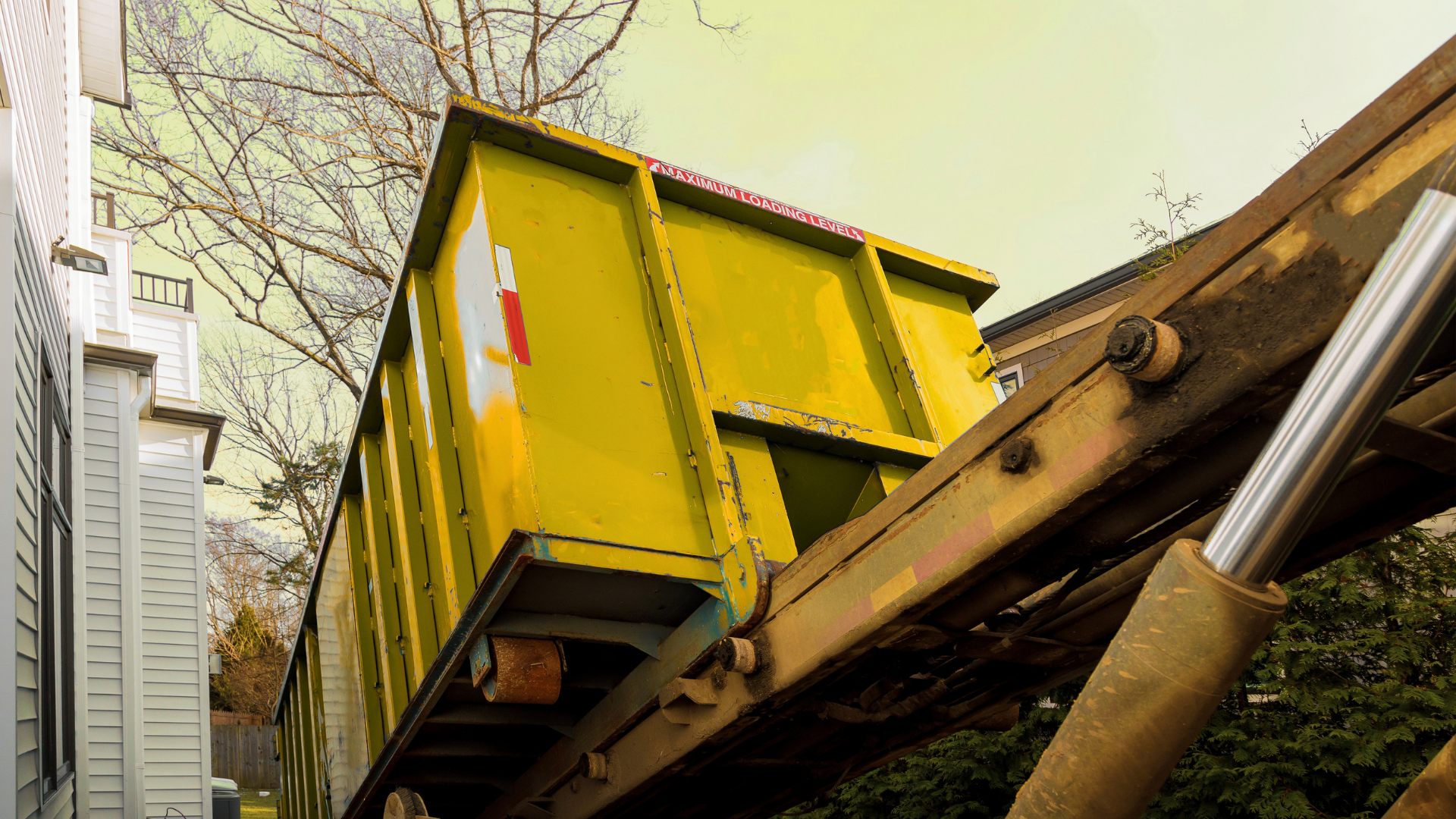 Job site cleanup with multiple construction dumpsters in use