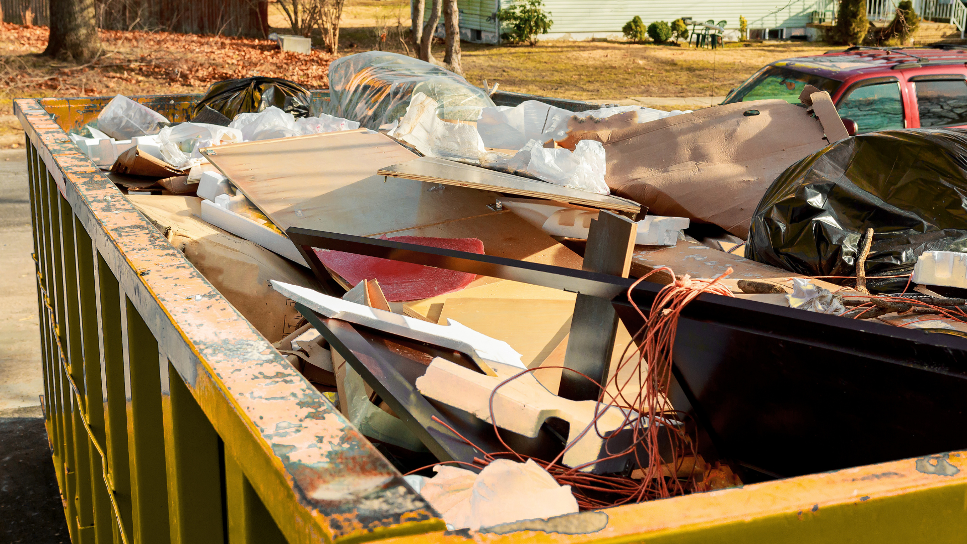 Dumpster positioned for siding replacement project in Summerville