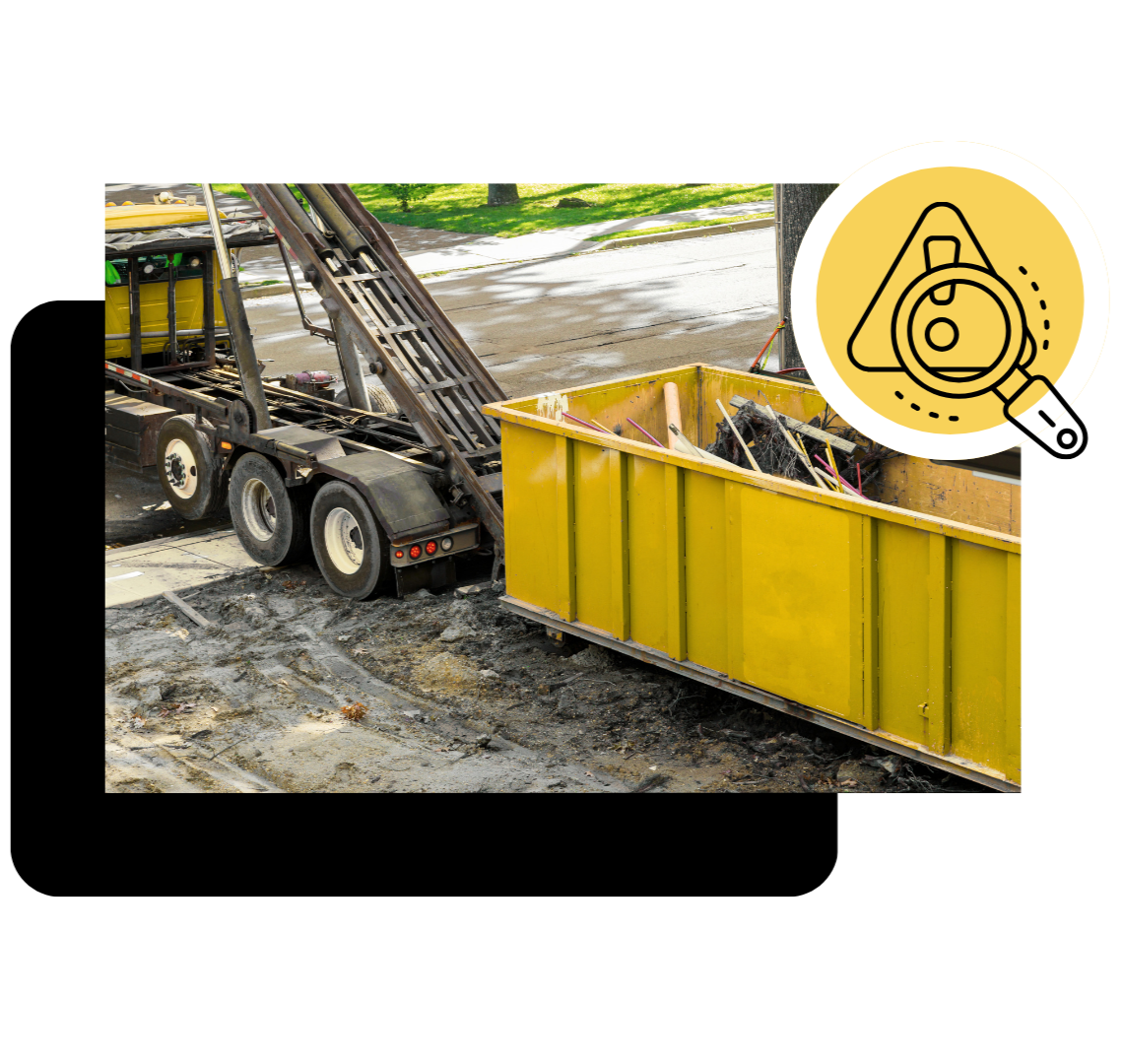 Concrete debris being loaded into heavy duty dumpster container