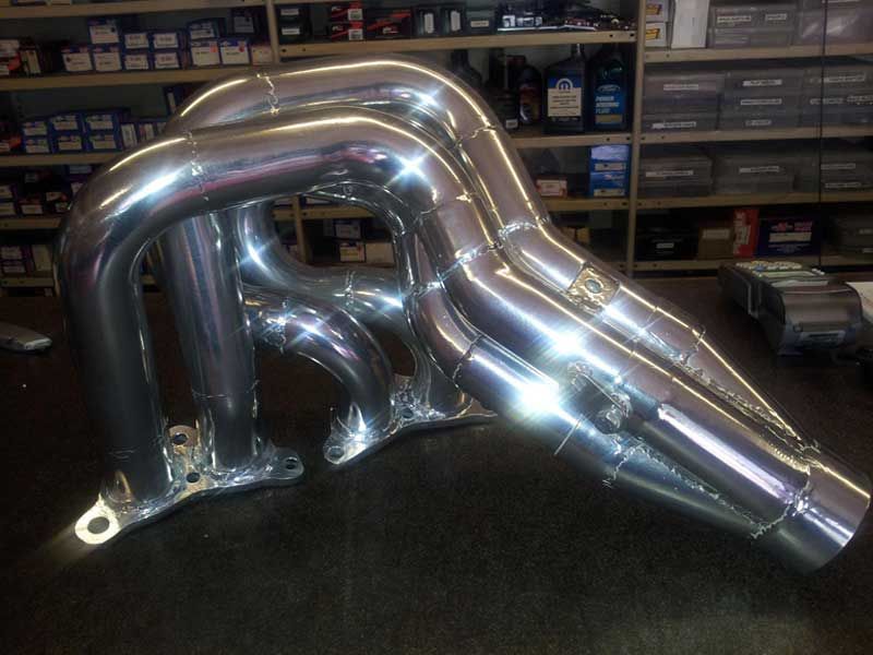 A Chrome Exhaust Pipe is Sitting on a Table in a Store — Hastings River Brake & Exhaust in Port Macquarie, NSW