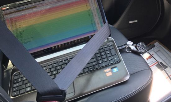 A Bucket Filled With Brown Liquid is Sitting on a Table — Hastings River Brake & Exhaust in Port Macquarie, NSW