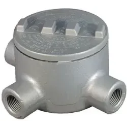 A metal box with three holes in it on a white background.