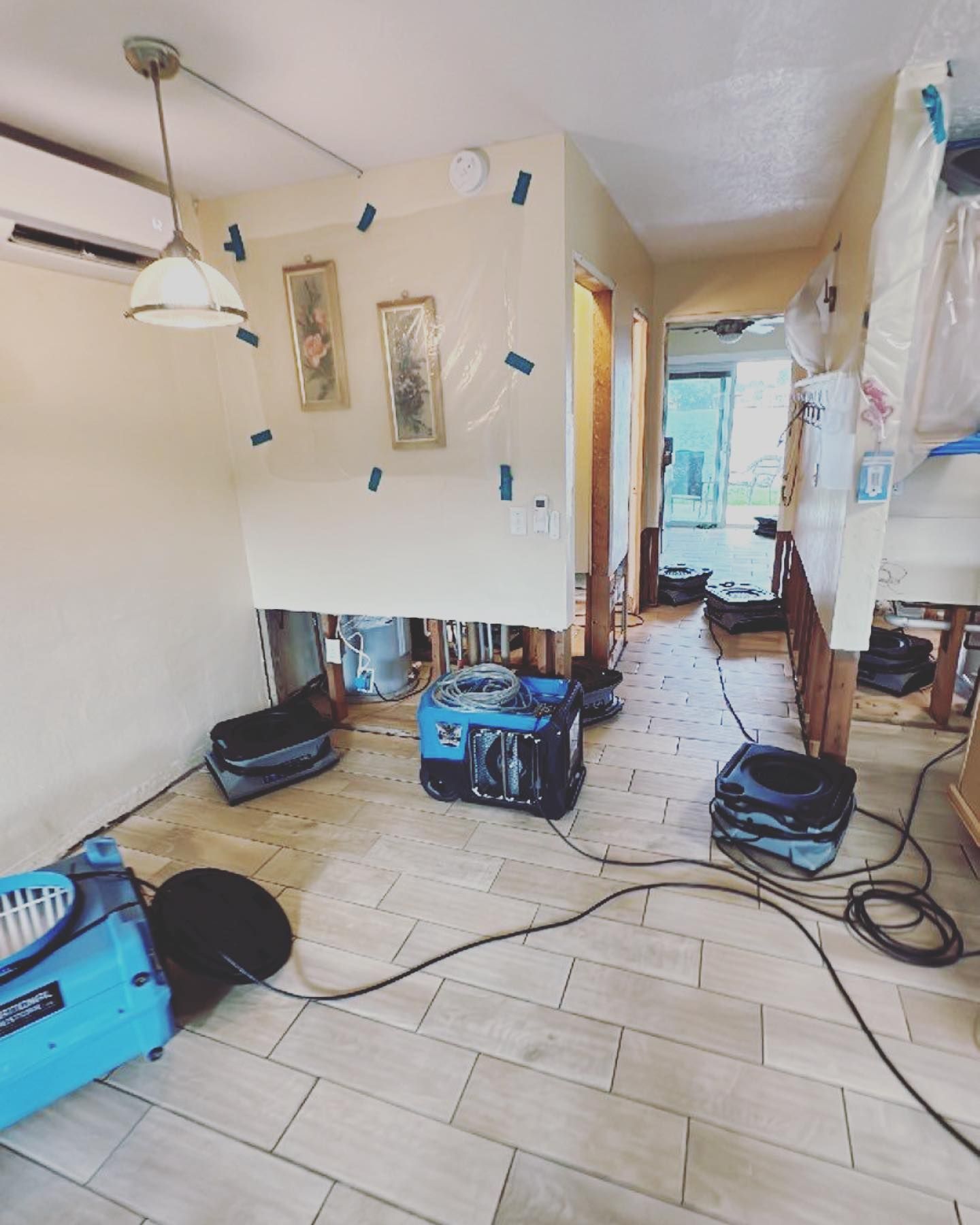 Interior room with drying equipment; possible water damage repair.