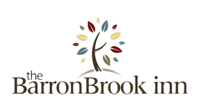 A logo for the barronbrook inn with a tree in the middle