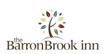 A logo for the barronbrook inn with a tree in the middle