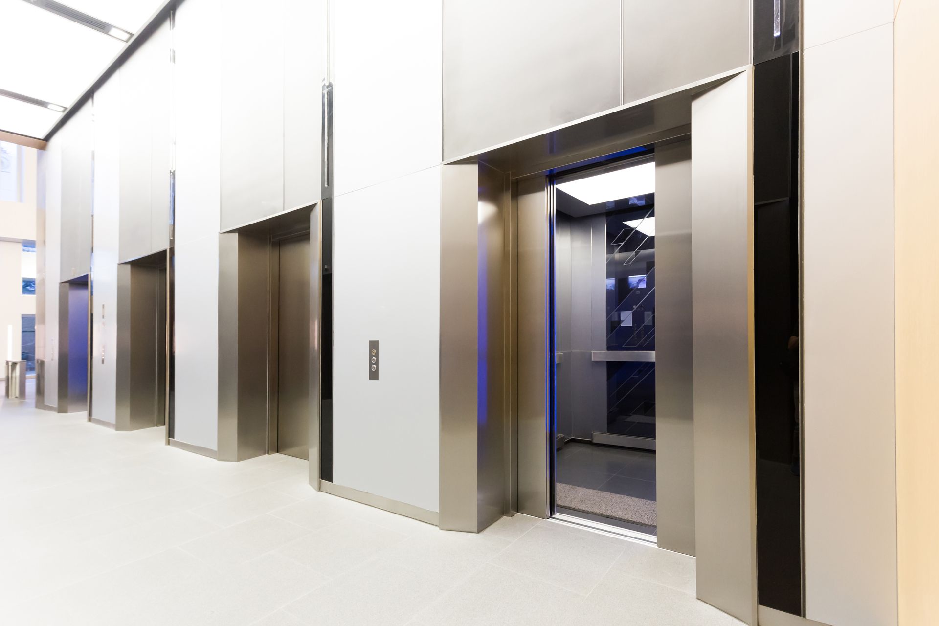 Elevator bank in a modern building with open door