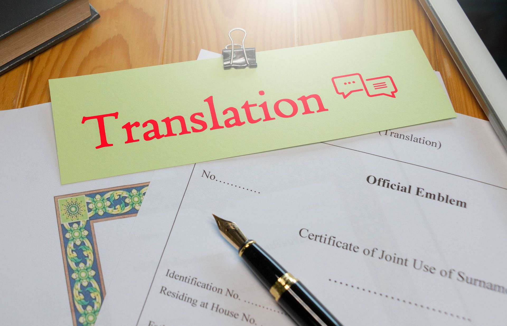A pen is sitting on top of a piece of paper that says translation