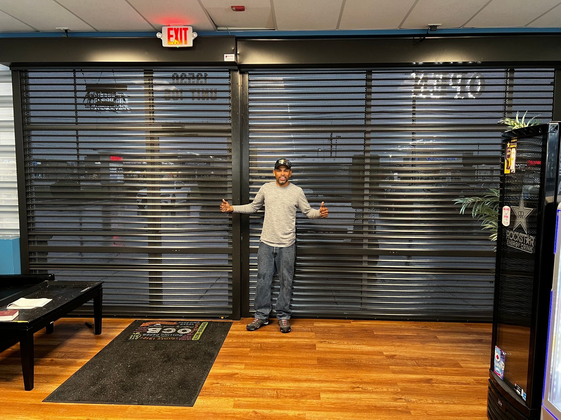 Man In Front Of Security Shutter — Chicago, IL — National Shutter System