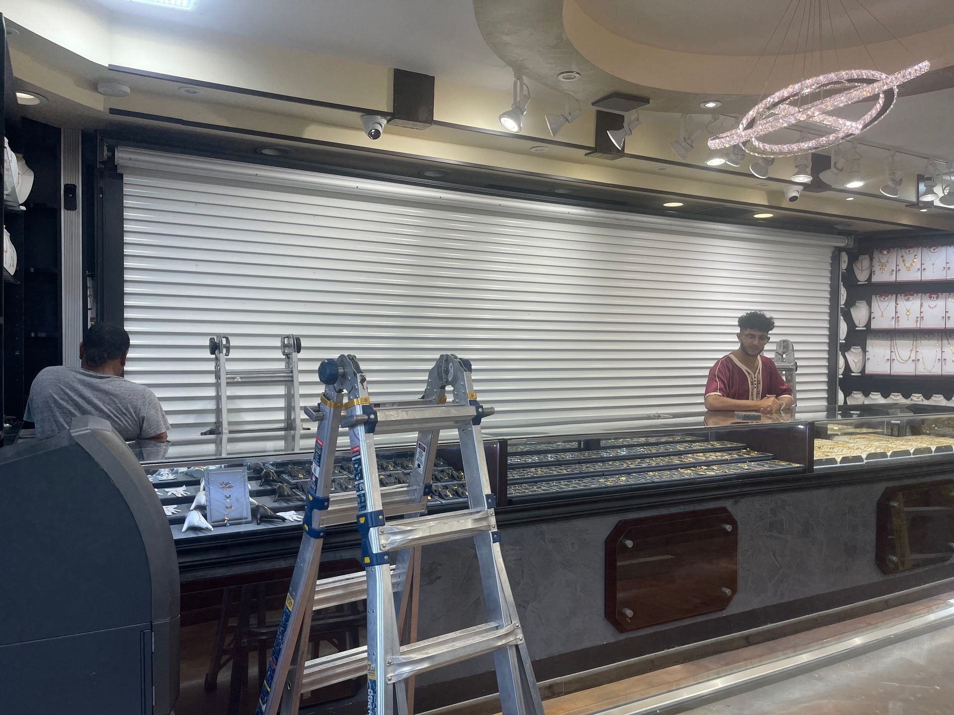 Workers Installing Security Shutter — Chicago, IL — National Shutter System