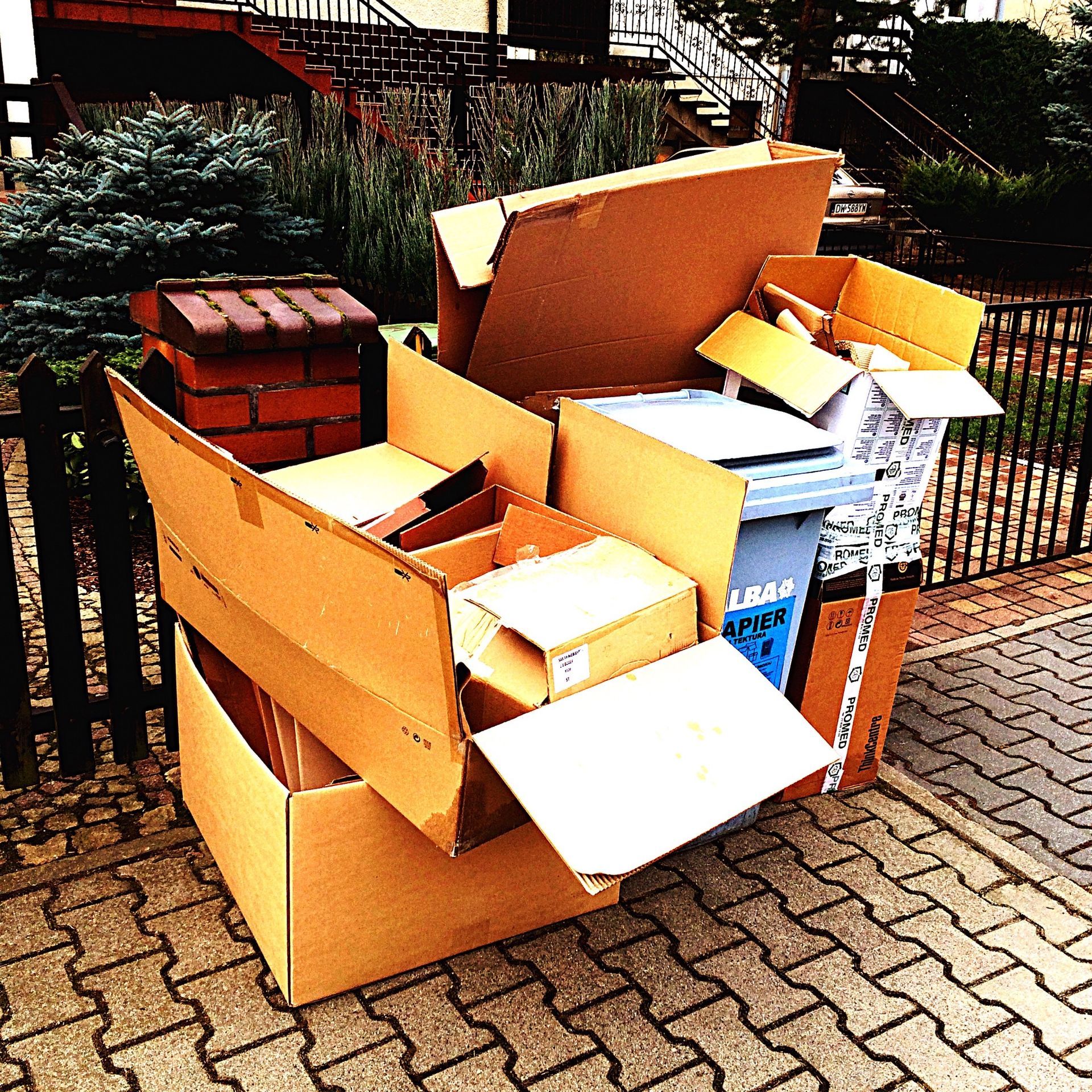 A pile of cardboard boxes including one that says amazon on it