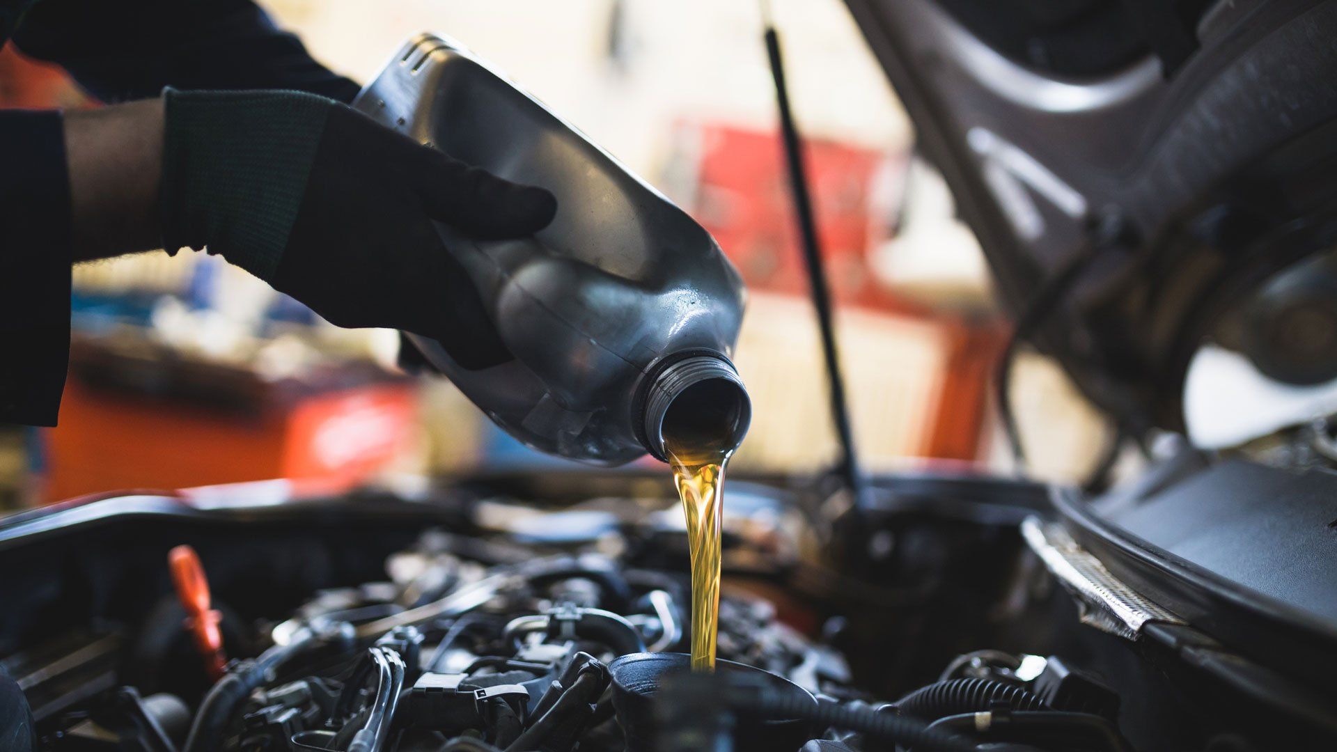 Pouring Oil to The Engine — Wellington, CO — Mountain View Automotive LLC