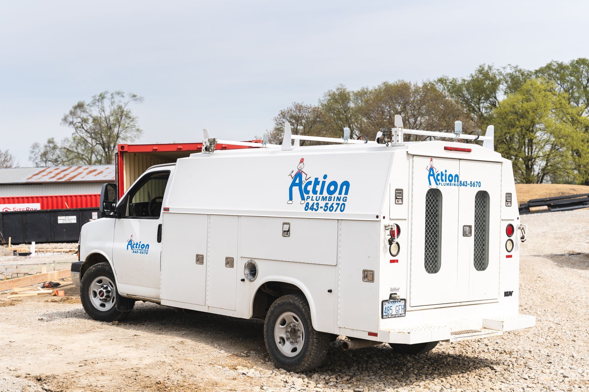a white van with the words action plumbing on it