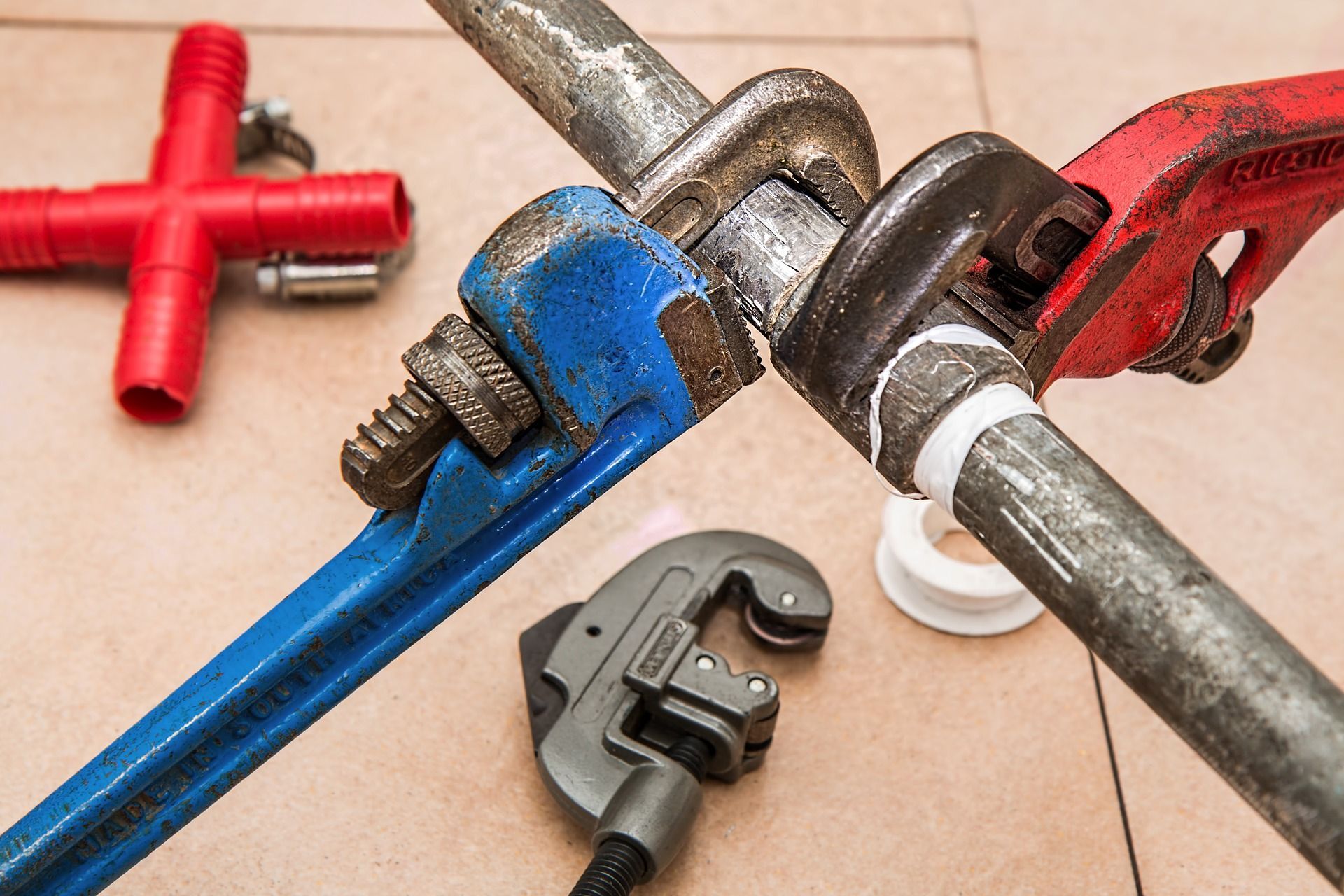 wrenches on a plumbing pipe .