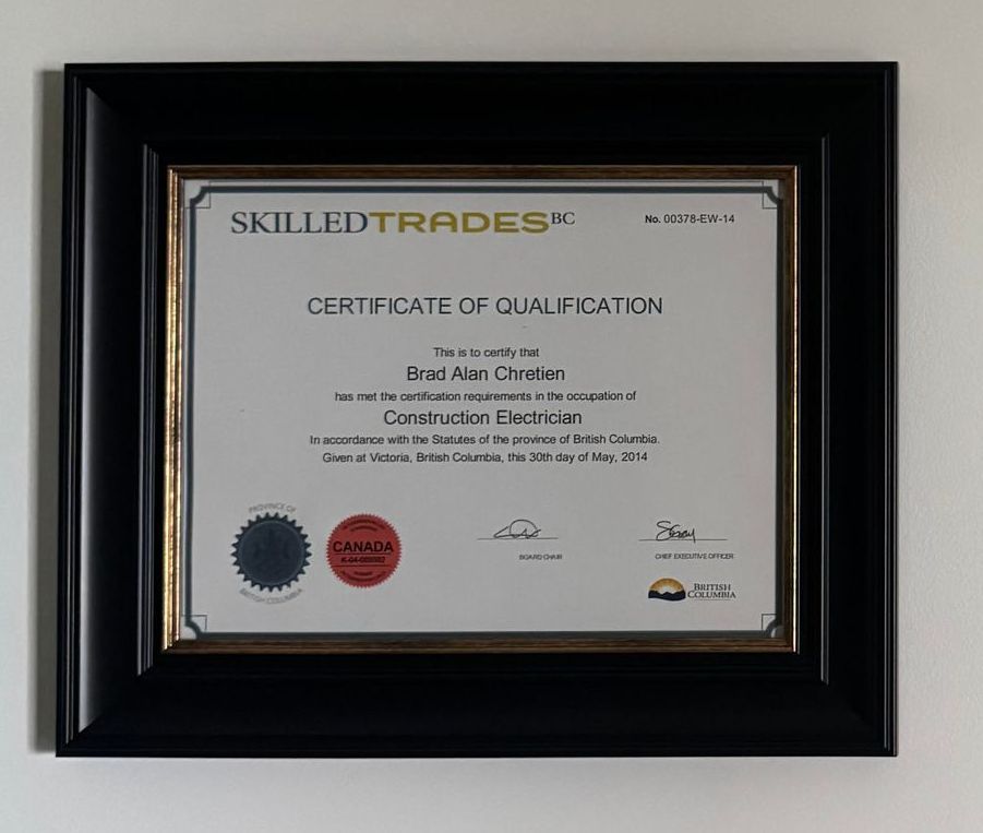 Framed certificate from SkilledTradesBC for Brad Alex Charles, a certified Construction Electrician in British Columbia.