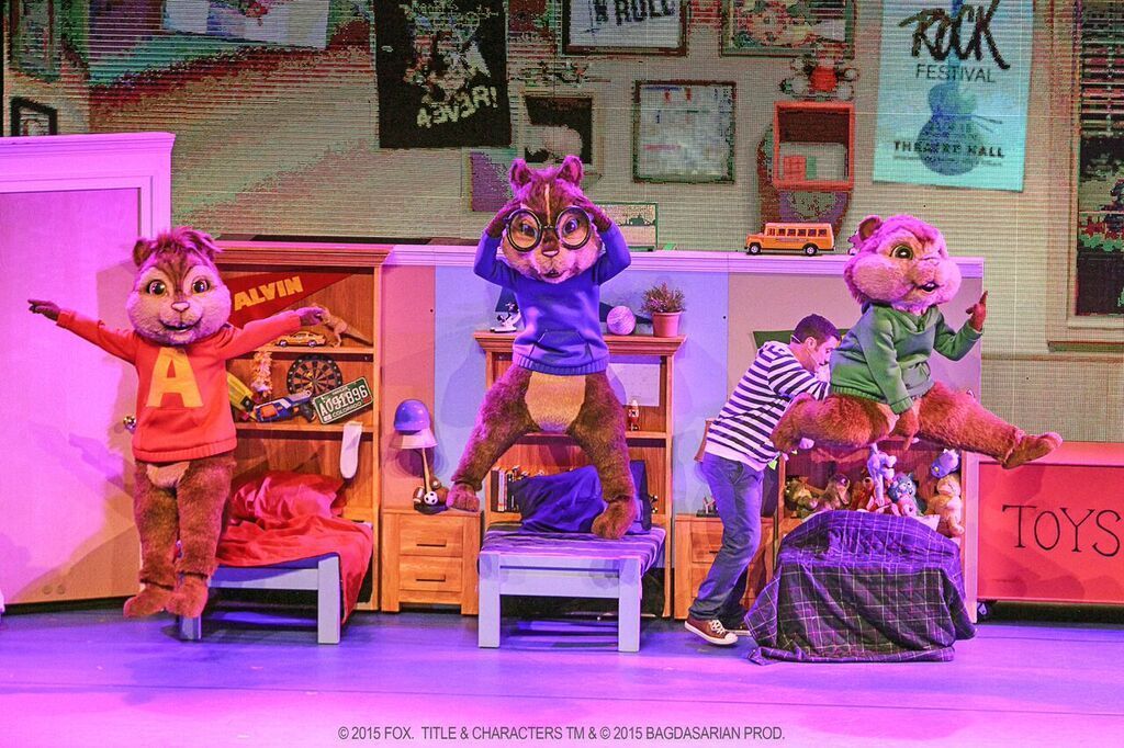 A group of alvin and the chipmunks are dancing on a stage.