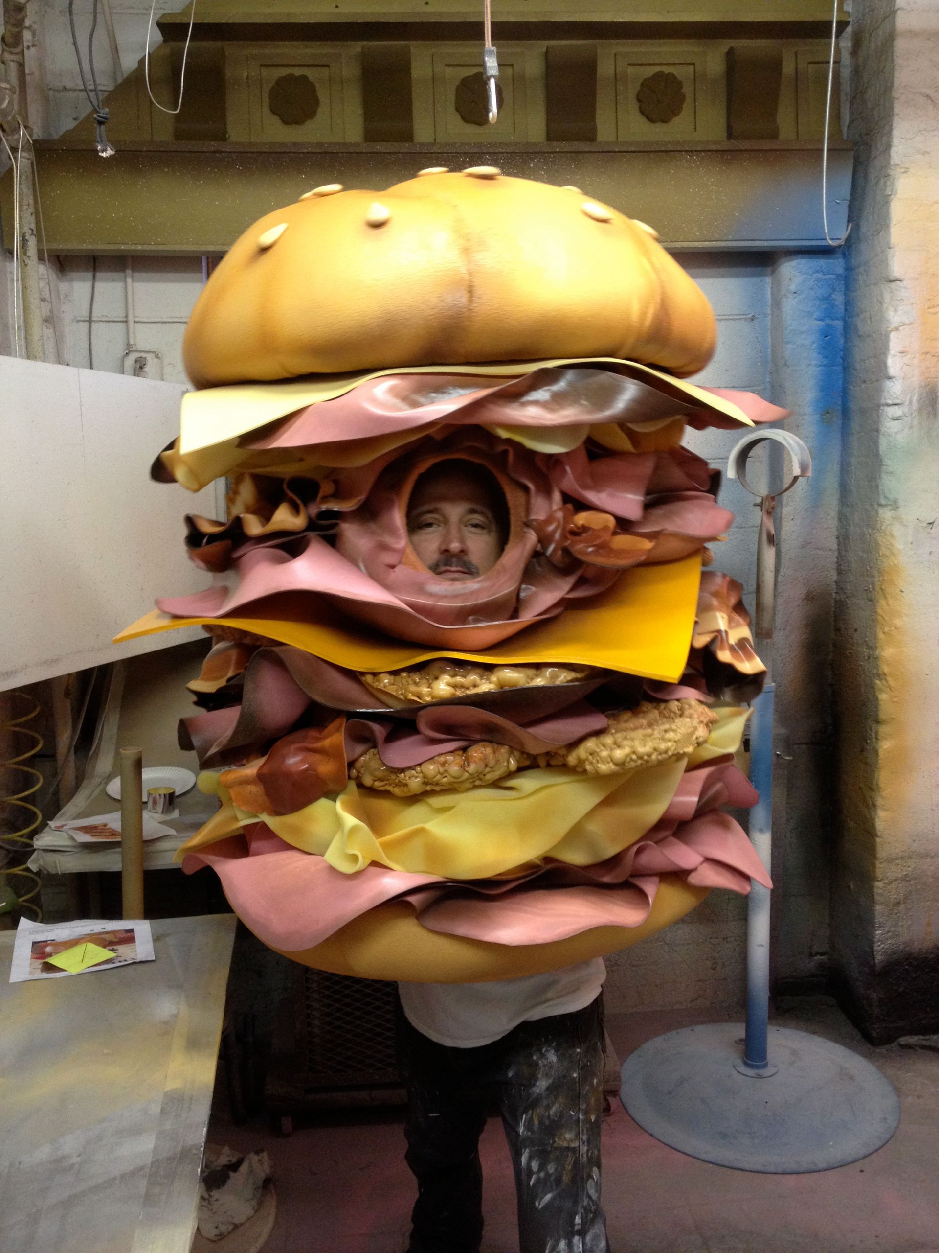 A man in a costume that looks like a hamburger