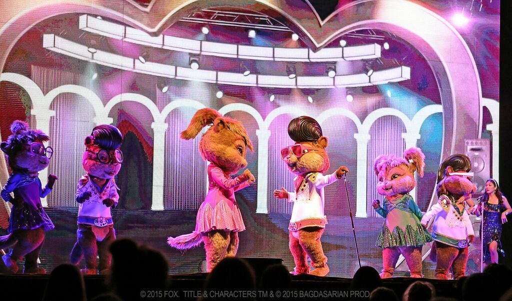 A group of alvin and the chipmunks are dancing on a stage.