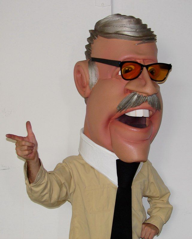 A caricature of stan lee wearing sunglasses and a tie