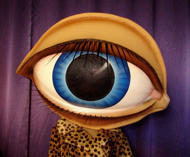 A large cartoon eye with a blue pupil