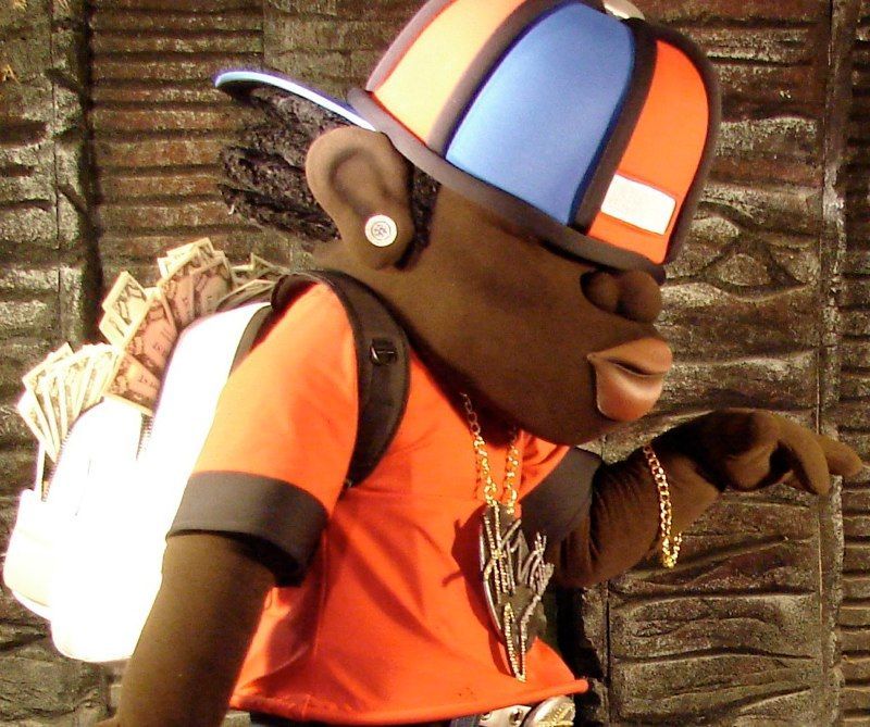 A cartoon character wearing an orange shirt and a blue hat
