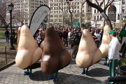 A group of people standing in front of a sign that says miracle
