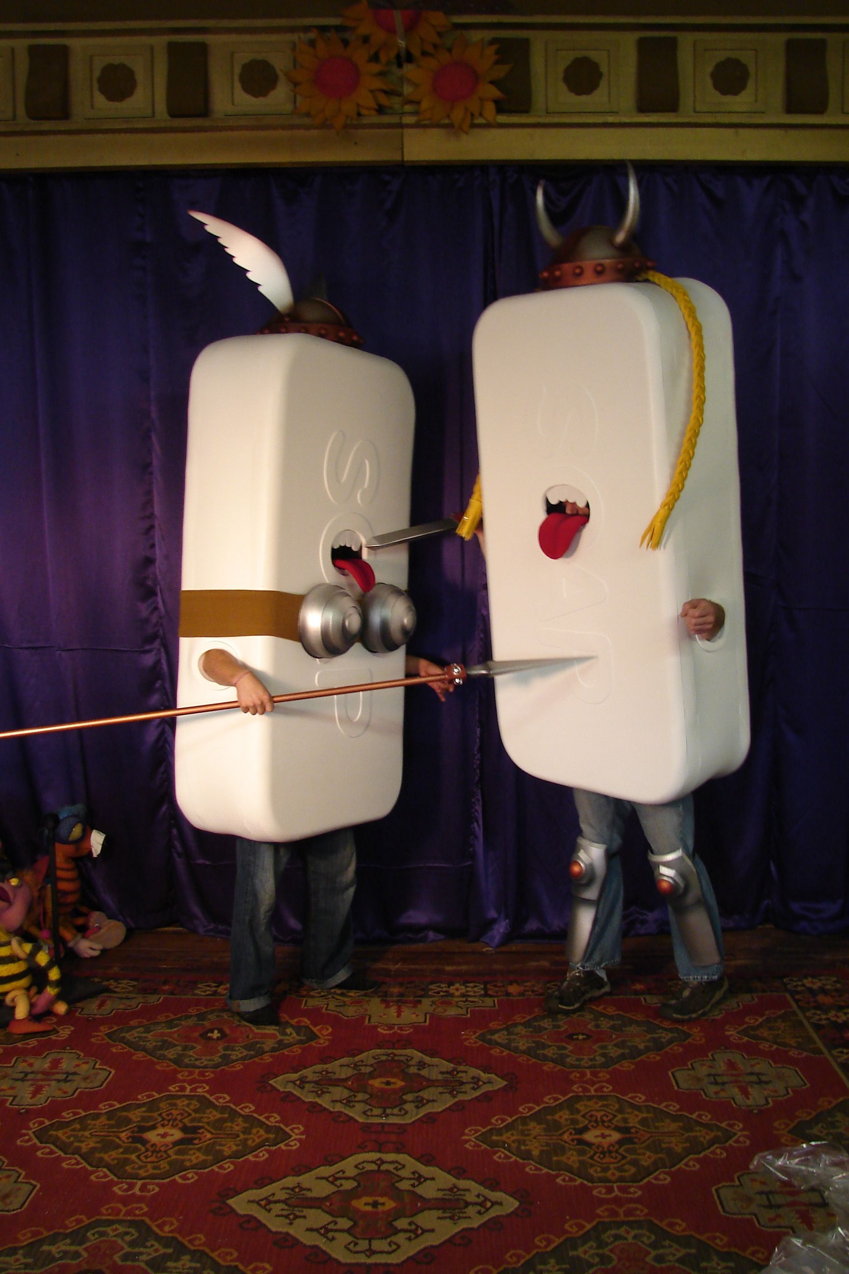 Two people dressed as marshmallows are standing next to each other