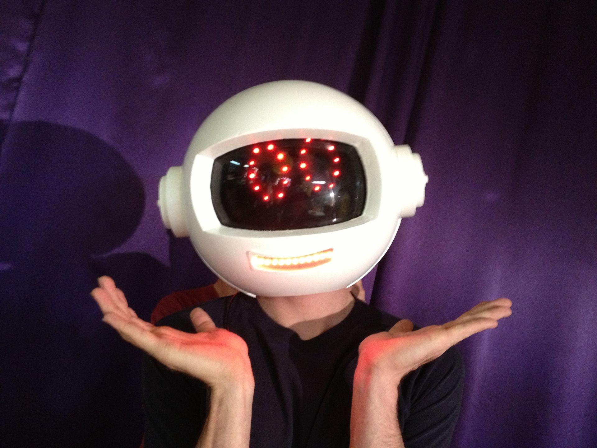 A man wearing a helmet with the number 99 on it